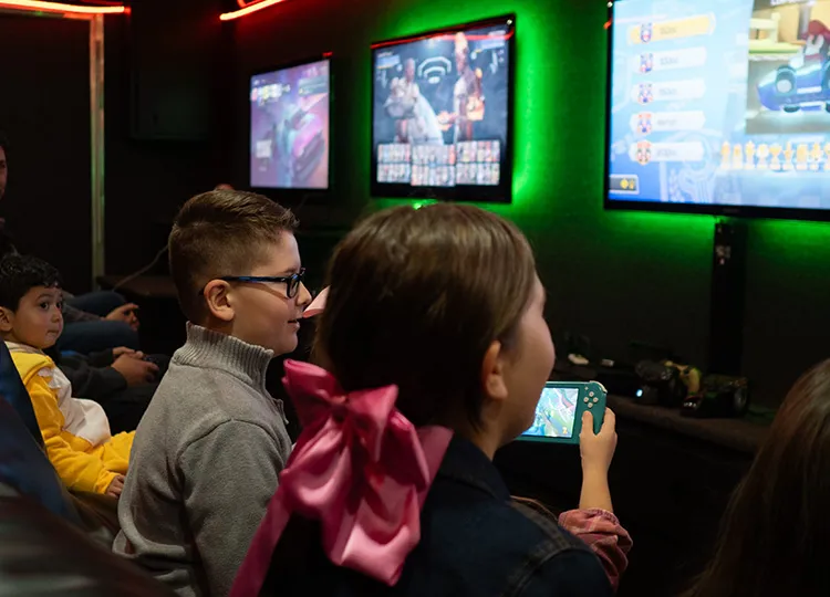 Kids enjoying VIP treatment at a GameTruck video game birthday party