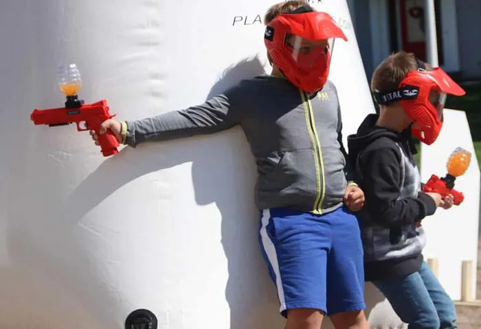 Kids firing GelTag blasters at a GameTruck event