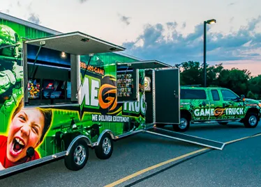 GameTruck video game trailer with doors open at an event